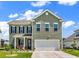 Charming two-story home with a well-manicured lawn and a welcoming front porch at 732 Mustang Ranch Dr., Myrtle Beach, SC 29588