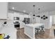 Bright kitchen featuring white cabinets, stainless steel appliances, and a center island with seating at 732 Mustang Ranch Dr., Myrtle Beach, SC 29588