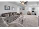 Spacious living room with neutral walls, plush seating, carpet, and ample natural light at 732 Mustang Ranch Dr., Myrtle Beach, SC 29588