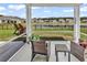 Relaxing screened patio overlooking a serene pond and green lawn at 732 Mustang Ranch Dr., Myrtle Beach, SC 29588