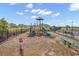 Community playground featuring a slide, seesaw, and climbing structure for outdoor recreation at 732 Mustang Ranch Dr., Myrtle Beach, SC 29588