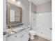 Bathroom features a granite countertop, white cabinets, and a walk-in shower at 901 Knoll Shores Ct. # 304, Murrells Inlet, SC 29576
