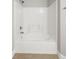 A white bathtub and shower with tile surround at 901 Knoll Shores Ct. # 304, Murrells Inlet, SC 29576