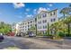 Exterior of the property showcasing the building's architectural design, balconies, and well-maintained landscaping at 901 Knoll Shores Ct. # 304, Murrells Inlet, SC 29576