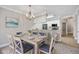 Charming dining room with a table, seating for six, and a kitchen breakfast bar at 901 Knoll Shores Ct. # 304, Murrells Inlet, SC 29576