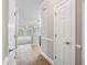 Hallway view showing tile floors and an open view of the kitchen and living area at 901 Knoll Shores Ct. # 304, Murrells Inlet, SC 29576