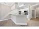 Modern kitchen with white cabinets, stainless steel appliances, and breakfast bar provides a clean space at 901 Knoll Shores Ct. # 304, Murrells Inlet, SC 29576
