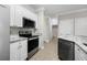 Kitchen appliance area with a view of the hall with doors to other rooms at 901 Knoll Shores Ct. # 304, Murrells Inlet, SC 29576