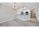 Kitchen with white cabinets, stainless steel appliances, and marble countertops provides a clean space at 901 Knoll Shores Ct. # 304, Murrells Inlet, SC 29576