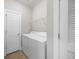 Laundry room includes a washer, dryer, and wire shelving for storage at 901 Knoll Shores Ct. # 304, Murrells Inlet, SC 29576