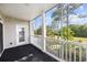 Screened porch with views of trees and sky, perfect for outdoor living at 901 Knoll Shores Ct. # 304, Murrells Inlet, SC 29576