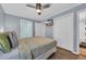 Comfortable bedroom features a mounted TV and closet at 9400 Shore Dr. # 206, Myrtle Beach, SC 29572