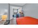 Bright bedroom view into the living area with a TV and balcony access, offering relaxation and entertainment at 9400 Shore Dr. # 206, Myrtle Beach, SC 29572