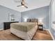 Cozy bedroom features a ceiling fan, hardwood floors, and relaxing decor at 9400 Shore Dr. # 206, Myrtle Beach, SC 29572