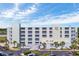 Exterior view of the Sands Beach Club with multiple balconies, ramp access, and parking at 9400 Shore Dr. # 206, Myrtle Beach, SC 29572