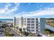 Sands Beach Club exterior with ocean views, well-manicured landscaping, and convenient parking at 9400 Shore Dr. # 206, Myrtle Beach, SC 29572