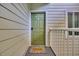 Charming front door with a seashell accent and welcome mat at 9400 Shore Dr. # 206, Myrtle Beach, SC 29572