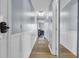 Well-lit hallway with hardwood floors and wainscoting leading to the living areas at 9400 Shore Dr. # 206, Myrtle Beach, SC 29572