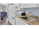 Compact kitchen space with white appliances and plenty of counter space at 9400 Shore Dr. # 206, Myrtle Beach, SC 29572