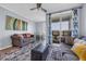 Inviting living room featuring stylish furniture, ceiling fan, with a balcony and dining area at 9400 Shore Dr. # 206, Myrtle Beach, SC 29572