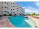 Bright and sunny view of the outdoor pool and lounge area at the resort at 9400 Shore Dr. # 206, Myrtle Beach, SC 29572
