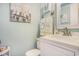 Stylish half bathroom with elegant vanity, nautical-themed decor, and modern fixtures at 9581 Shore Dr. # 216, Myrtle Beach, SC 29572