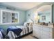 Charming bedroom with a twin bed, serene decor, and sunny window providing natural light at 9581 Shore Dr. # 216, Myrtle Beach, SC 29572