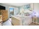Coastal themed bedroom with a king bed, balcony access and dresser at 9581 Shore Dr. # 216, Myrtle Beach, SC 29572