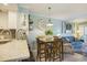 Dining area open to living room and kitchen with coastal-themed accents and decorations at 9581 Shore Dr. # 216, Myrtle Beach, SC 29572