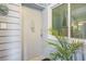 Welcoming entryway with decorative accents, including a beach-themed sign and lush potted plant at 9581 Shore Dr. # 216, Myrtle Beach, SC 29572