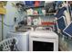 Functional laundry room with modern washer and dryer, plus ample shelving for storage at 9581 Shore Dr. # 216, Myrtle Beach, SC 29572