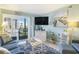 Comfortable living room with access to a balcony and a beach-themed decor at 9581 Shore Dr. # 216, Myrtle Beach, SC 29572