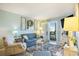 Cozy living room with a balcony view, coastal decor, and comfortable seating at 9581 Shore Dr. # 216, Myrtle Beach, SC 29572