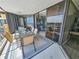 Charming balcony with glass table, seating, and sliding glass doors to the living area, offering scenic outdoor views at 9650 Shore Dr. # 1203, Myrtle Beach, SC 29572