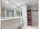 Bright bathroom featuring large mirror and built in shelving at 9650 Shore Dr. # 1203, Myrtle Beach, SC 29572