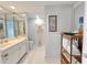 Well-lit bathroom with tiled floor, white vanity, and decorative accents at 9650 Shore Dr. # 1203, Myrtle Beach, SC 29572