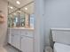 Bathroom with a tiled floor, large mirror and white vanity with storage at 9650 Shore Dr. # 1203, Myrtle Beach, SC 29572