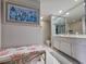 Bathroom with coral themed seating and a mirrored wall at 9650 Shore Dr. # 1203, Myrtle Beach, SC 29572
