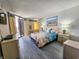 Serene bedroom featuring a comfortable bed, access to balcony, and calming decor for restful nights at 9650 Shore Dr. # 1203, Myrtle Beach, SC 29572