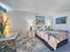 Comfortable bedroom with beach themed bedding, a workspace, and ocean themed decor at 9650 Shore Dr. # 1203, Myrtle Beach, SC 29572