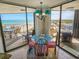Dining area with an ocean view from the balcony creating a serene atmosphere for meals at 9650 Shore Dr. # 1203, Myrtle Beach, SC 29572
