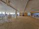 Under-building patio area with tables, chairs, and ocean views at 9650 Shore Dr. # 1203, Myrtle Beach, SC 29572