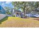Large, grassy backyard with a patio area perfect for outdoor entertaining at 99 Berry Tree Dr., Pawleys Island, SC 29585