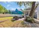 Beautiful backyard with a brick patio and lush landscaping provides a private retreat at 99 Berry Tree Dr., Pawleys Island, SC 29585