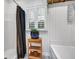 Bright bathroom with a combination shower, tub and black and white curtain at 99 Berry Tree Dr., Pawleys Island, SC 29585
