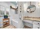Bright bathroom with white beadboard, tub, and granite countertop vanity at 99 Berry Tree Dr., Pawleys Island, SC 29585