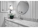 Bright bathroom with a granite countertop and brushed nickel faucet at 99 Berry Tree Dr., Pawleys Island, SC 29585