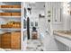 Stylish bathroom with white beadboard, baskets, and modern fixtures at 99 Berry Tree Dr., Pawleys Island, SC 29585