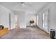 Bright room with a ceiling fan and doors that lead to a porch at 99 Berry Tree Dr., Pawleys Island, SC 29585