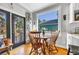 Charming breakfast nook with table, chairs, and view to the backyard at 99 Berry Tree Dr., Pawleys Island, SC 29585